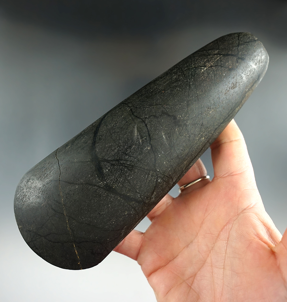 6 9/16" beautifully polished hardstone Celt that is broken and glued near the bit found in Borneo.