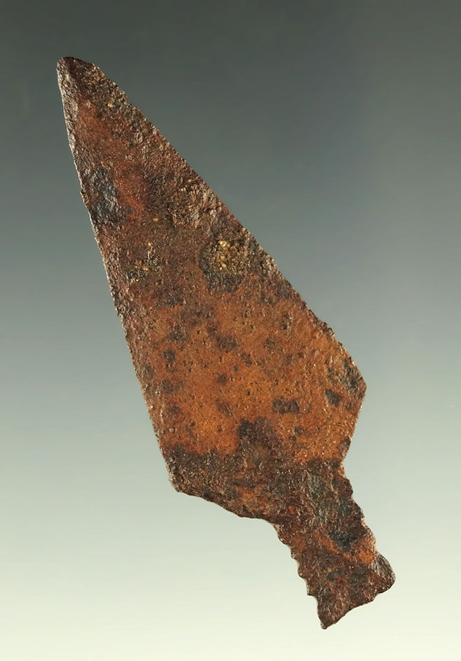 2 3/16" metal trade point found in the Plains region.