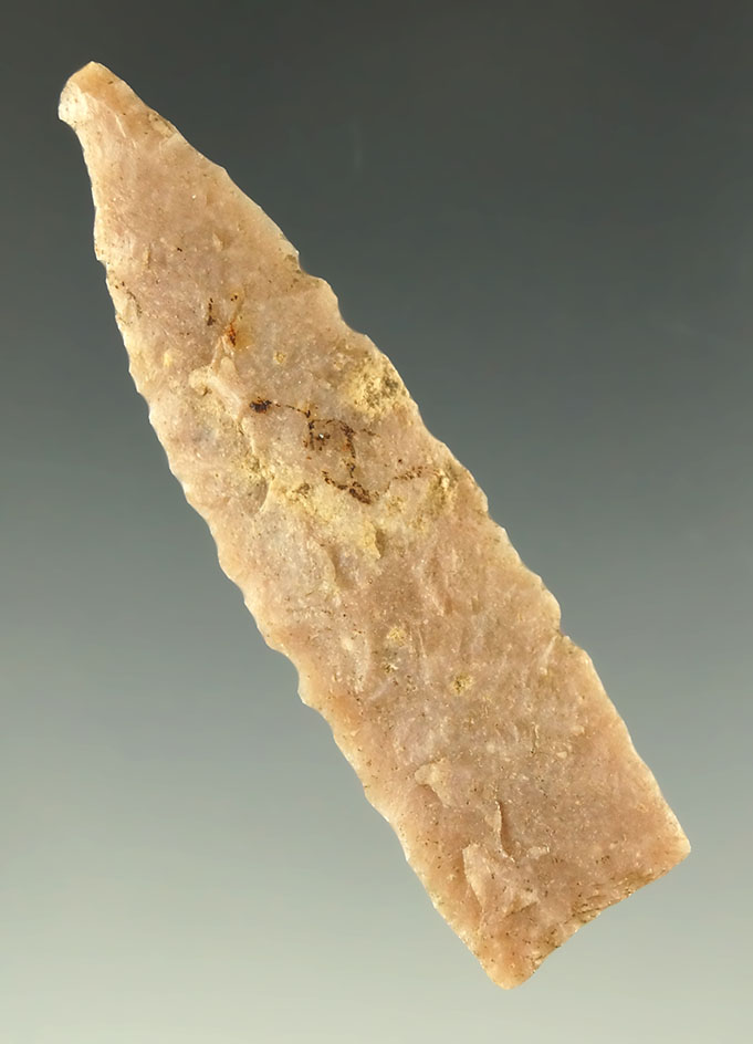 2 1/16" Triangular arrowhead that is well patinated found in Nebraska. Ex. Bob Roth.