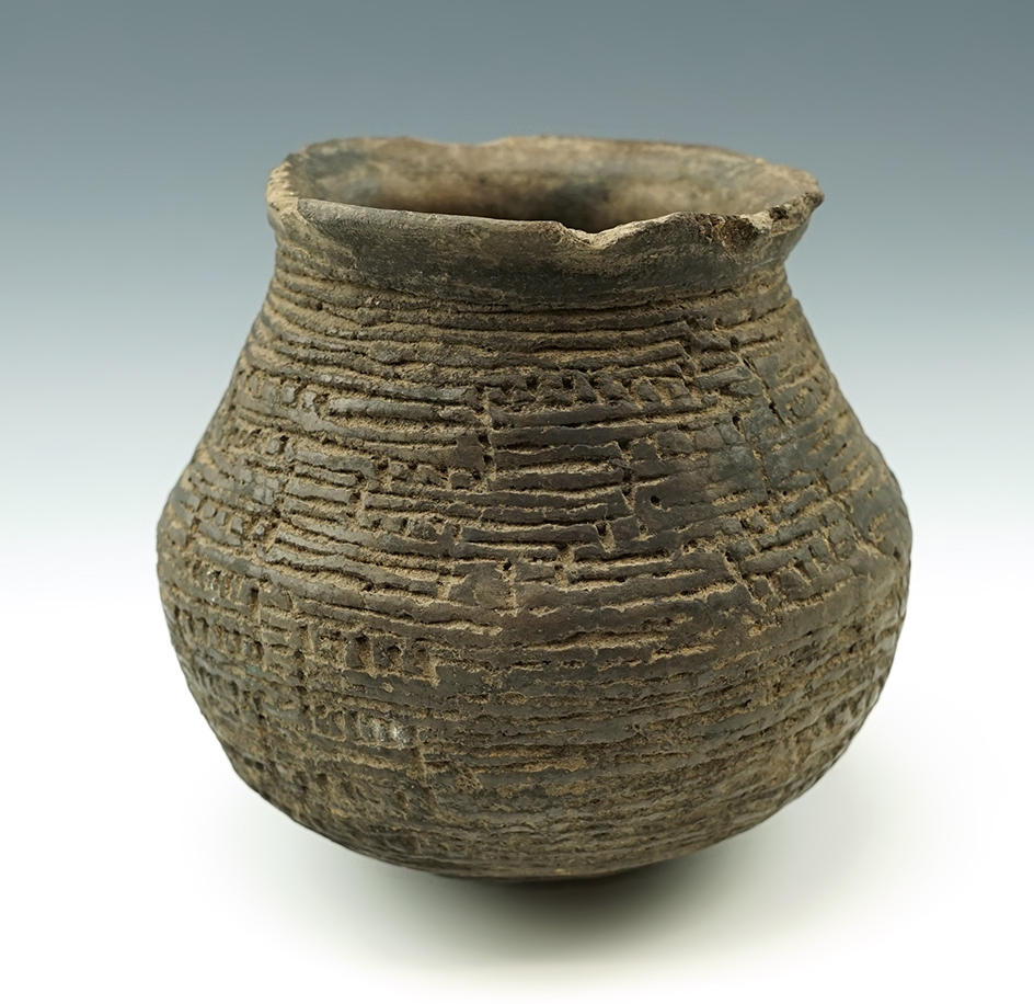 Attractive exterior design on this 5" tall ancient Southwestern pottery jar found in New Mexico.