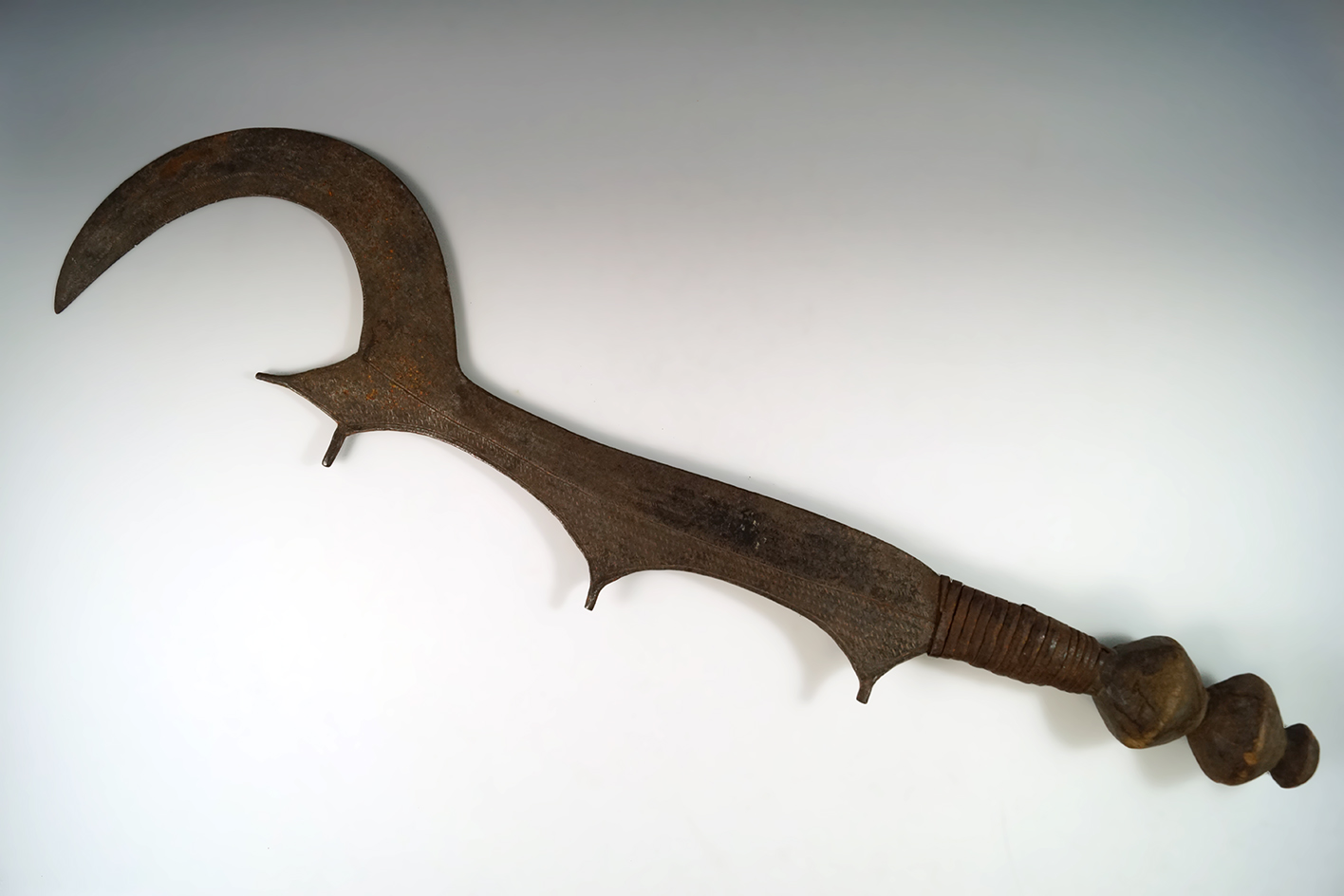 25" long Ngulu Sword. Hand carved wood handle, wire wrapped with metal blade.