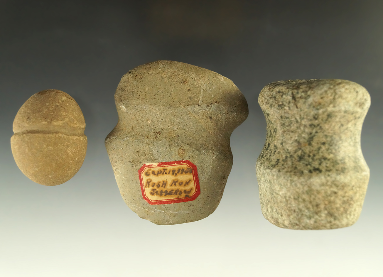 Set of three stone artifacts including a 3 1/16" full grooved miniature axe. All found in Ohio.