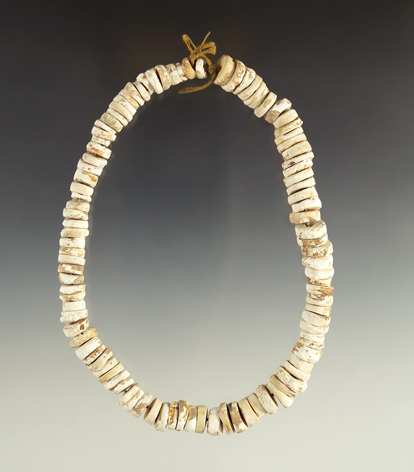 13" long strand of authentic drilled shell beads. These are not African knockoffs. Ex. Eulert.