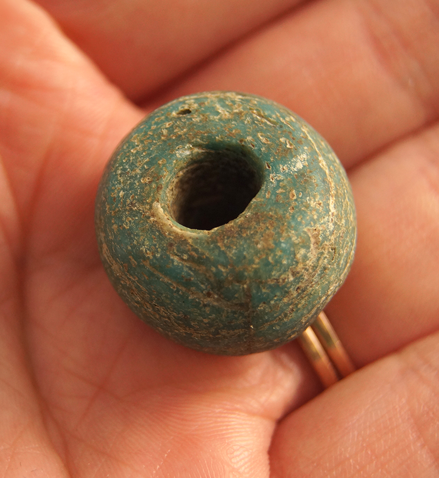 Heavily patinated 7/8" diameter Roman empire era Glass trade bead found in coastal Africa.