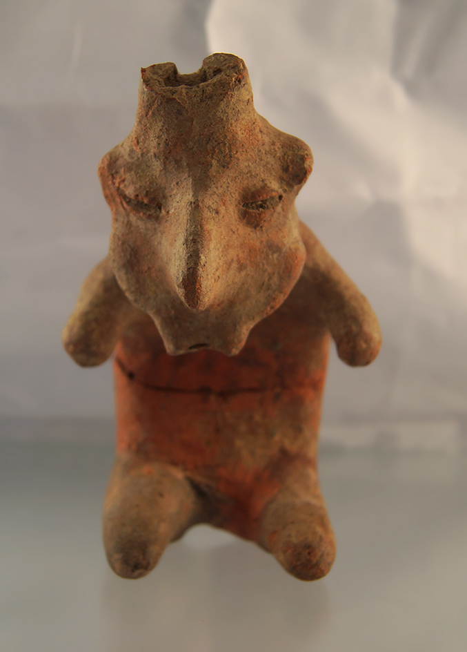 6" tall Nayarit Whistler statue that is broken and glued at the mid section. found in Mexico.