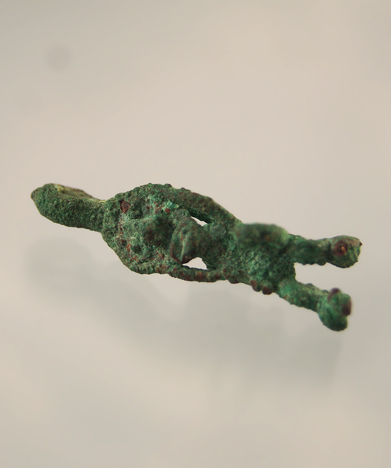 Delicately made 1 1/8" tall Moche culture copper figural ornament found in Peru.