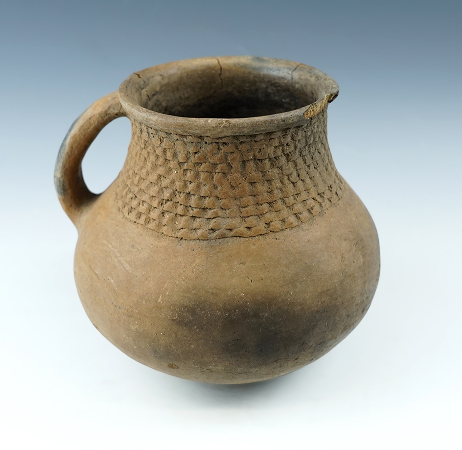 5 1/4" Tall by 5" Wide nicely styled Handled Bottle with nice rim design. New Mexico.