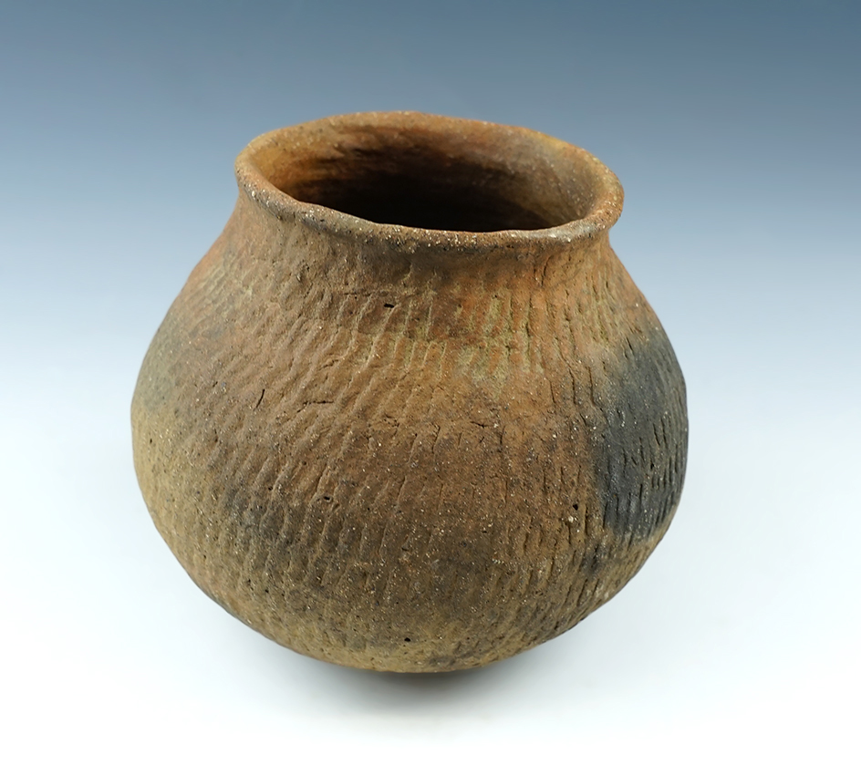 4 3/4" Tall by 5" Wide Corregated Pottery Vessel in excellent condition. Found in New Mexico.