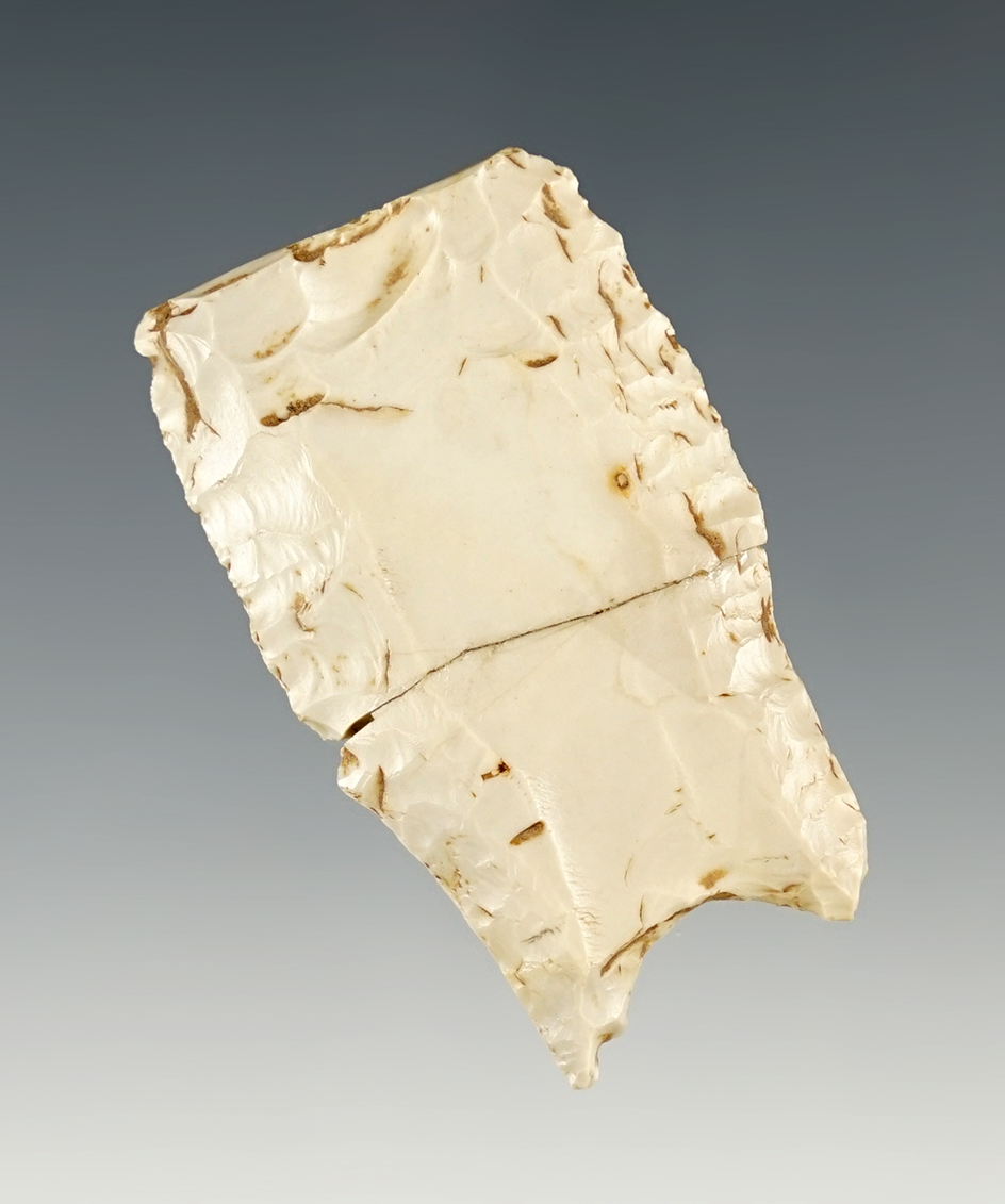 1 13/16" Folsom variant with nicely ground lower edges and two long flutes. Broken and glued.