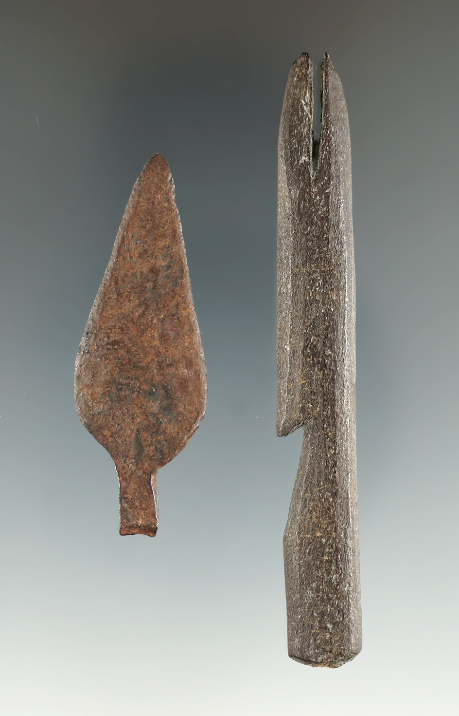 pair of artifacts found in the Pacific Northwest. 3 5/16" bone harpoon tip and a metal trade point.