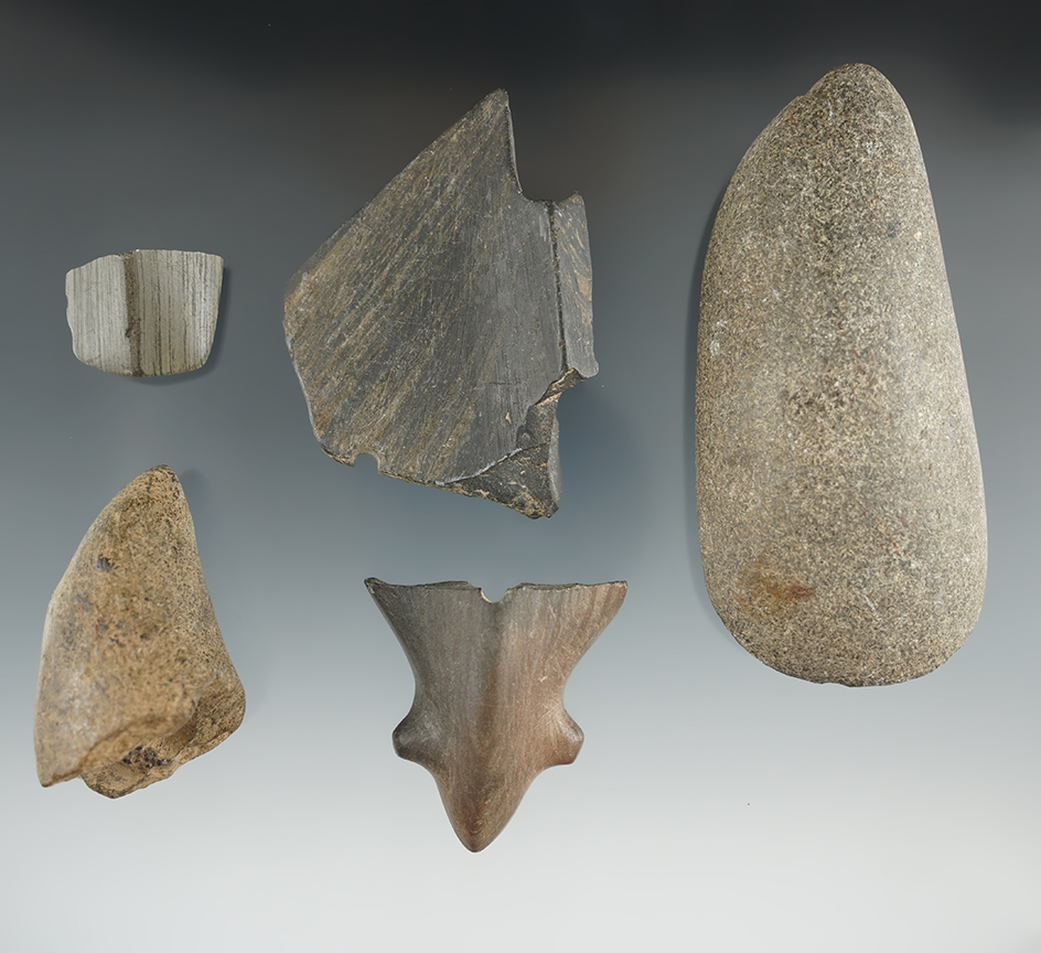 Group of assorted artifacts found in New York including a Birdstone tail, head, Halves and an Adze.