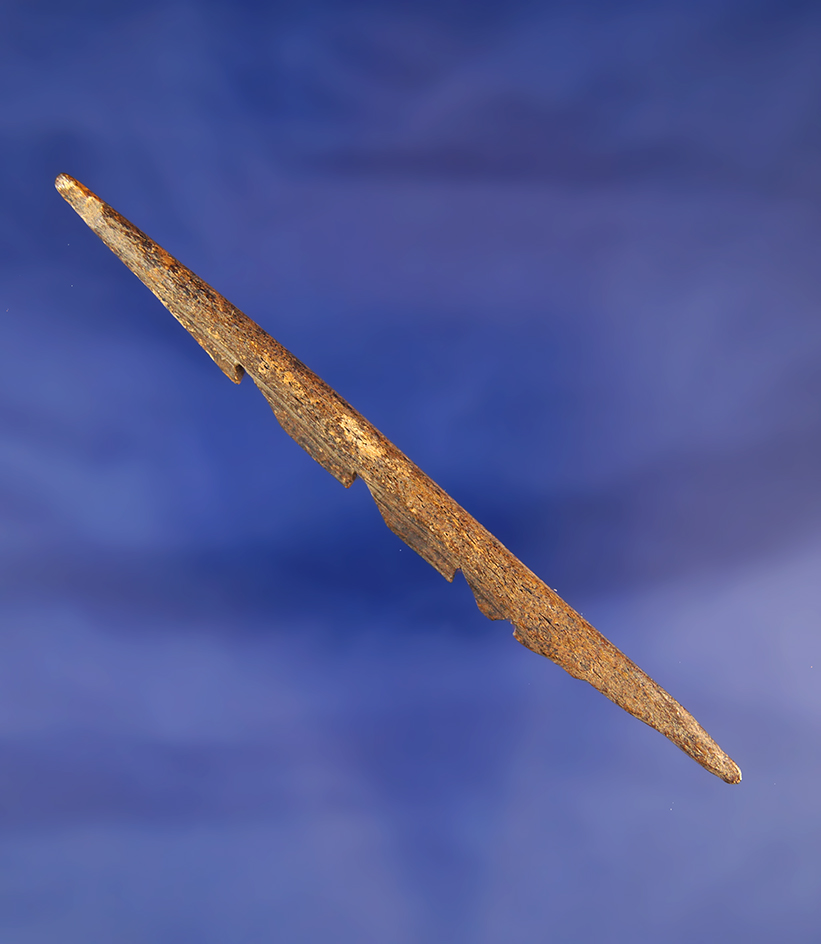 Well patinated 3 7/8" serrated harpoon tip made from bone found in Alaska.