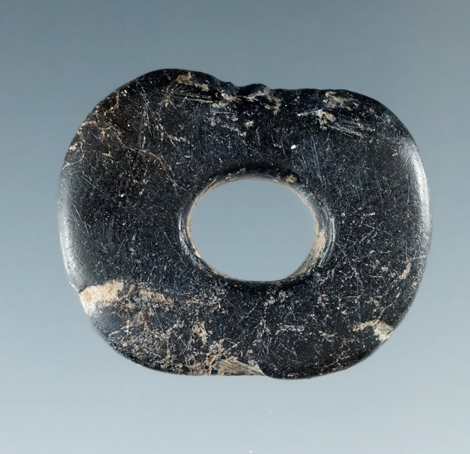 15/16" diameter perforated steatite ornaments that shows nice use wear hole. Columbia River.