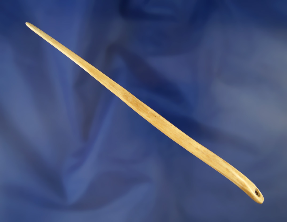 6 11/16" drilled Hairpin found in Kentucky made from nicely polished bone.  Bennett COA.