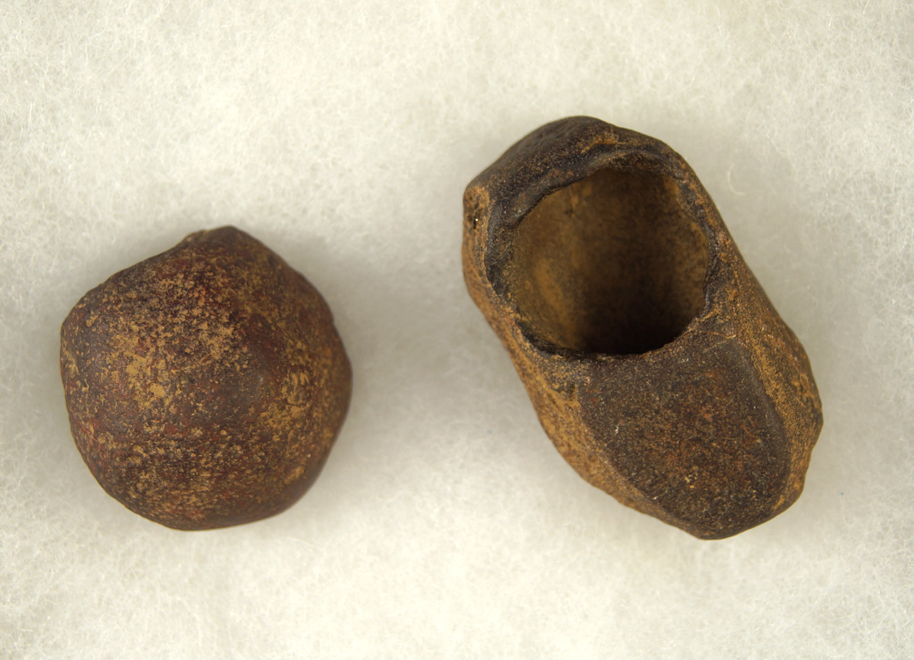 Pair of Hematite Relics including a concretion "paint cup" and a cone, largest is 2 3/16".
