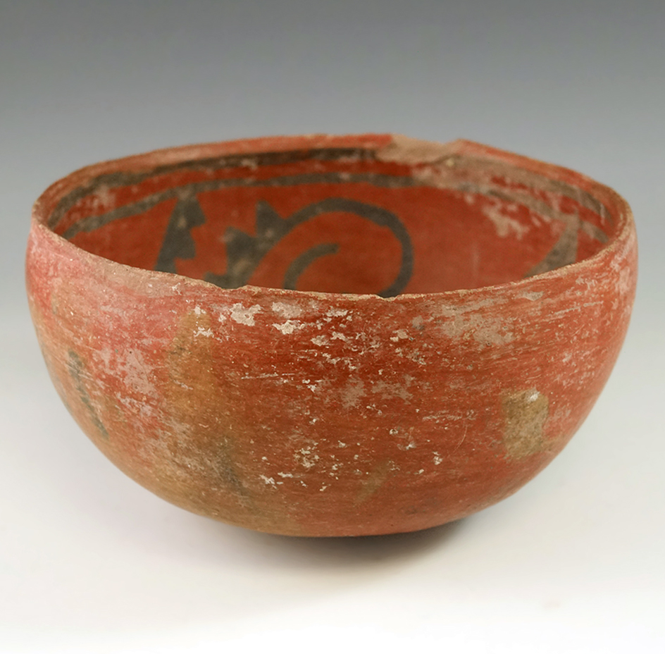 6" diameter redware bowl with nice interior paint design. A couple rim chips.