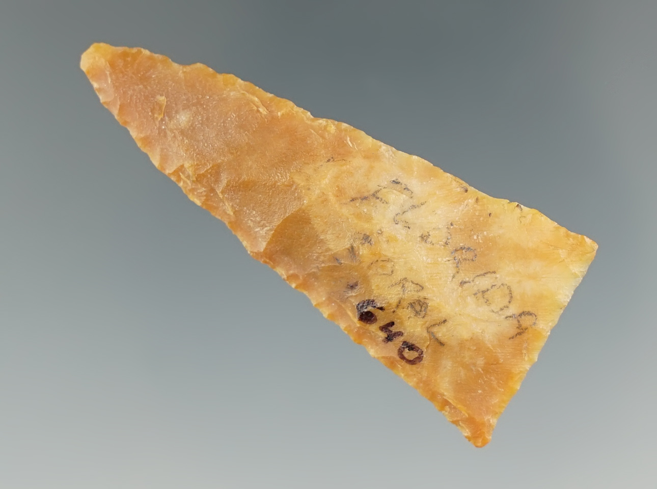 2 1/16" Pinellas/Safety Harbor Point made from semi-translucent orange flint, found in Florida.