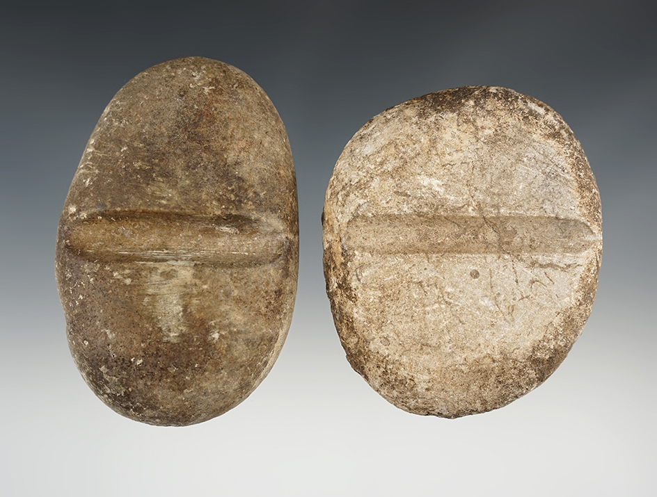 Pair of New Mexico Stone Arrow Shaft Smoothers in good condition. The largest is 3 3/4".