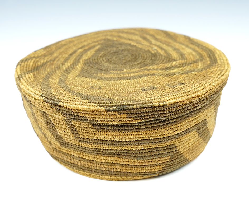 7 1/2" Wide x 2 5/8" tall woven lidded basket.