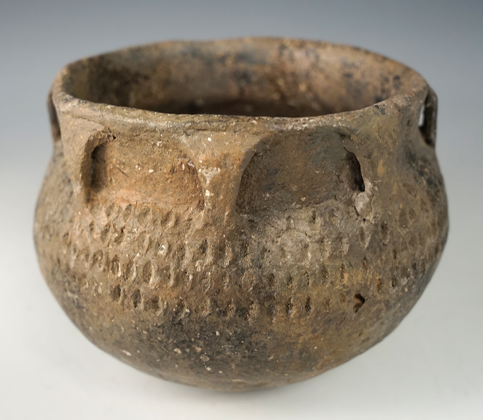 4 3/4" wide x 3 3/8" tall heavily restored Arkansas pottery vessel.