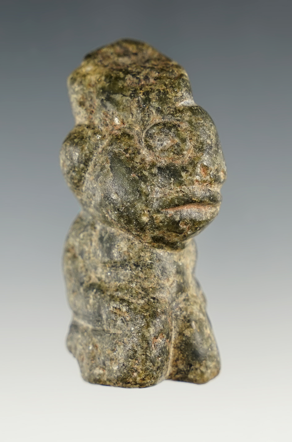 2 1/2" Per Columbian Seated Human Effigy that is heavily patinated. Found in Mesoamerican.