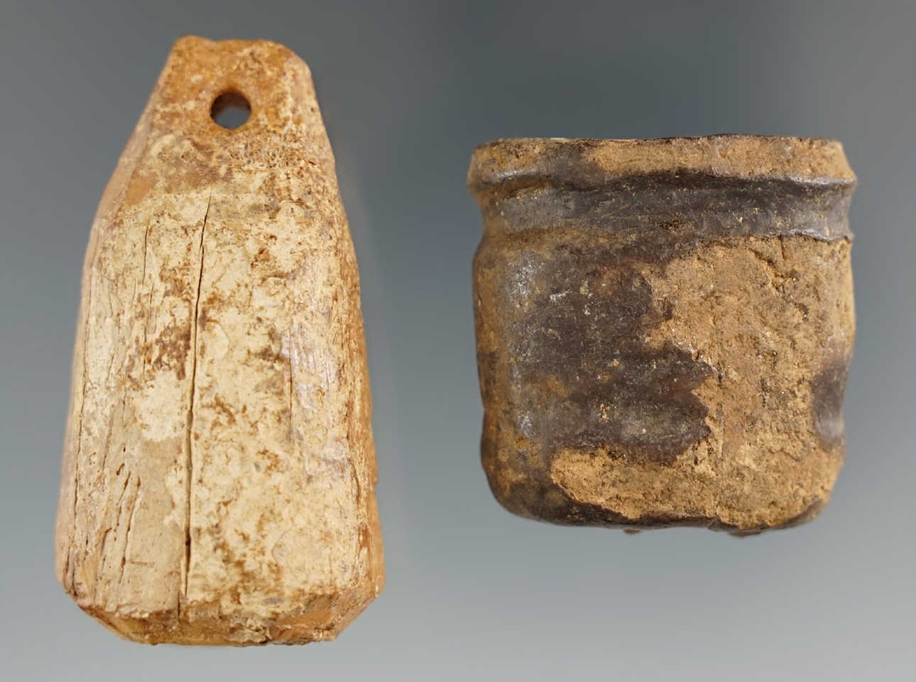 Pair of Inuit artifacts including a 1 5/16" bladder plug with a wood stopper and a 2" ivory bolo wei