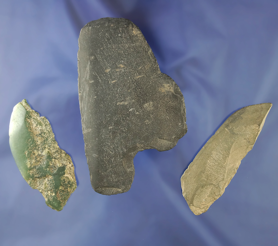 Three stone artifacts from Alaska including one piece of green ground Jade, two Ulu knives.