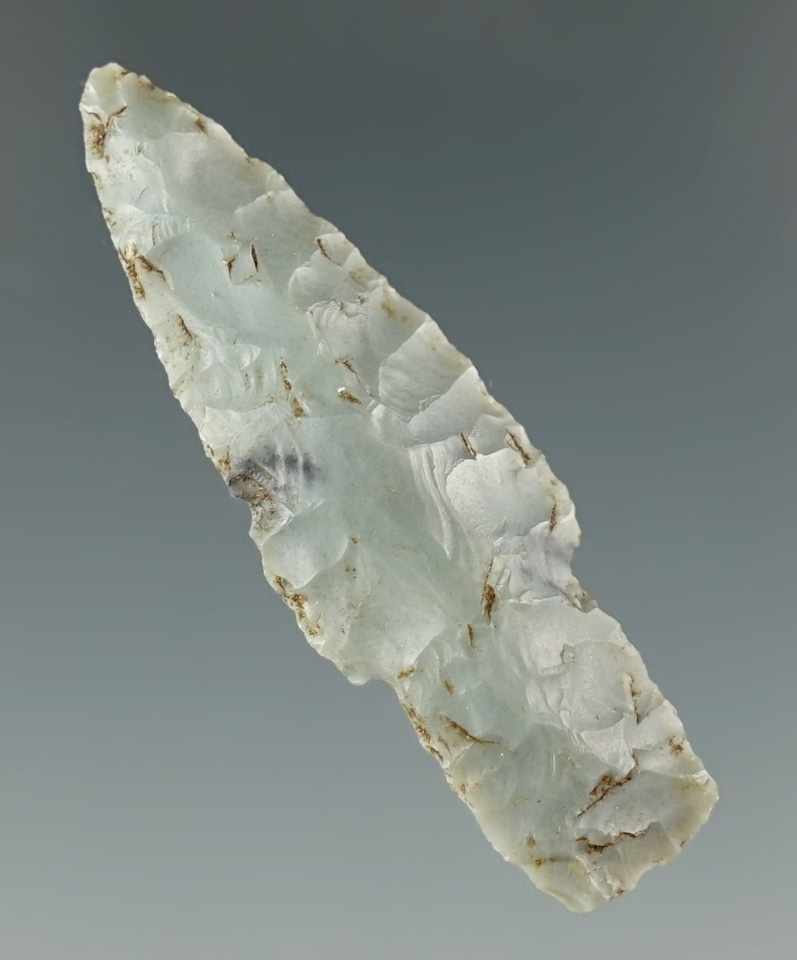 Excellent flaking and style on this 1 3/4" stemmed projectile point found in Alaska.