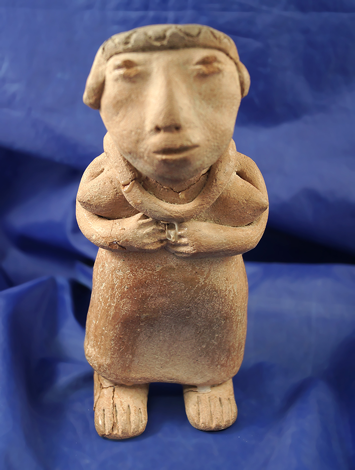 6 3/4" Pre-Columbian female pottery figure. Head and foot has been broken and reglued.