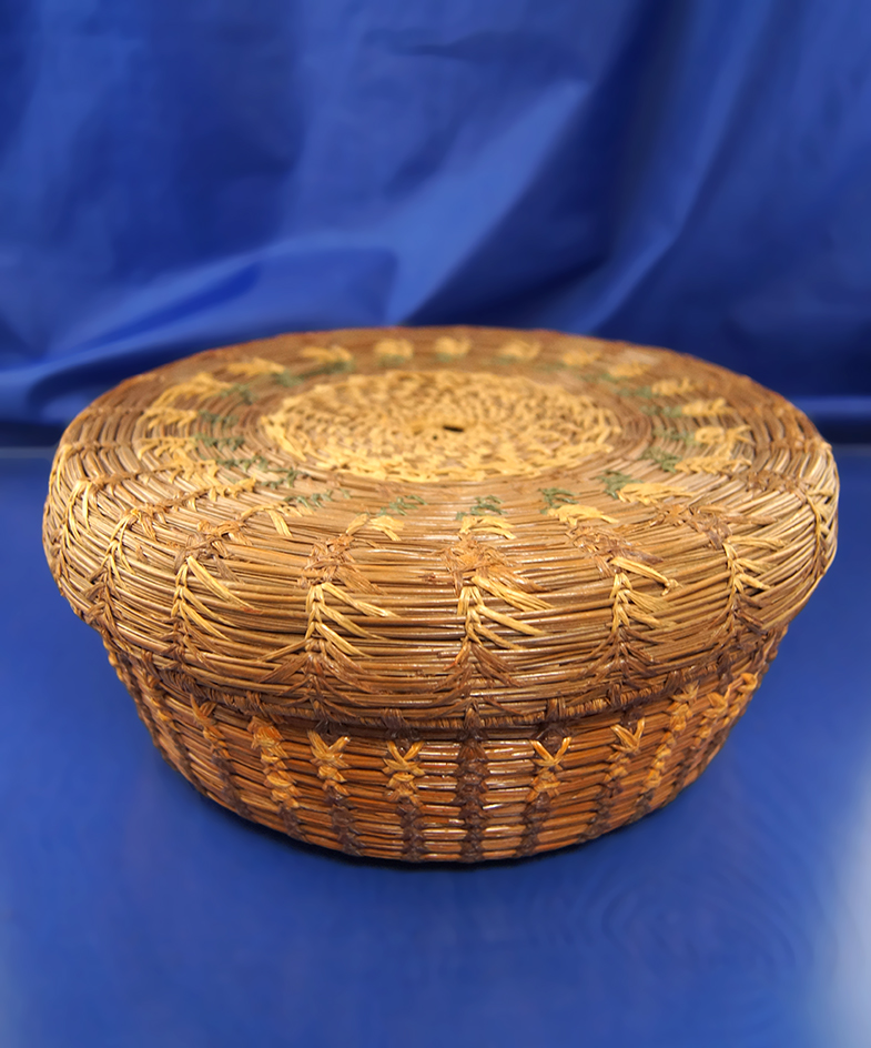 8 1/2" Wide early pine needle sewing basket in excellent condition.