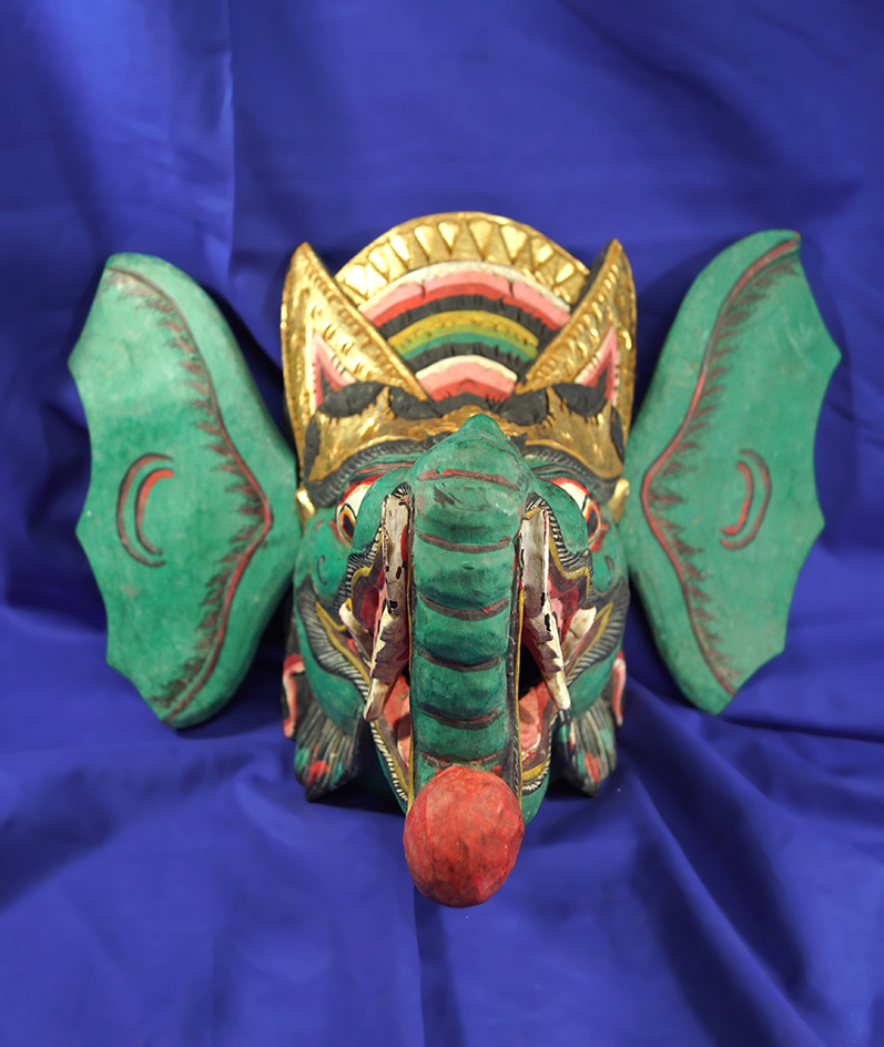 Very ornately decorated Indonesian dragon mask with detachable ears.  Exact origin unknown.