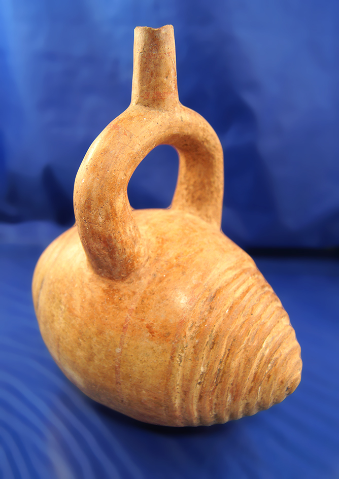 7 1/8" Tall Snail Effigy stirrup-spout bottle; Lambayeque, Peru; intact condition.