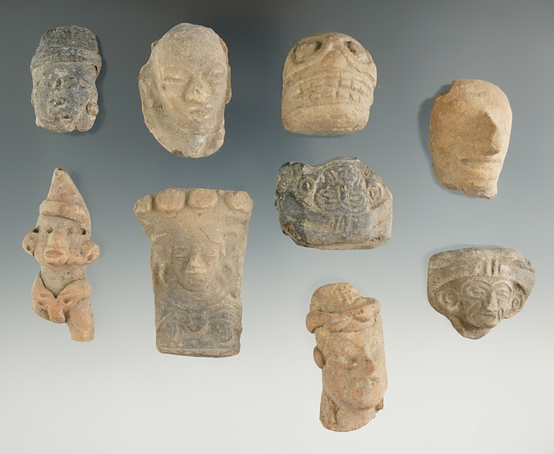 Set of nine pre-Columbian pottery heads found in Mexico. Largest is 1 7/8".