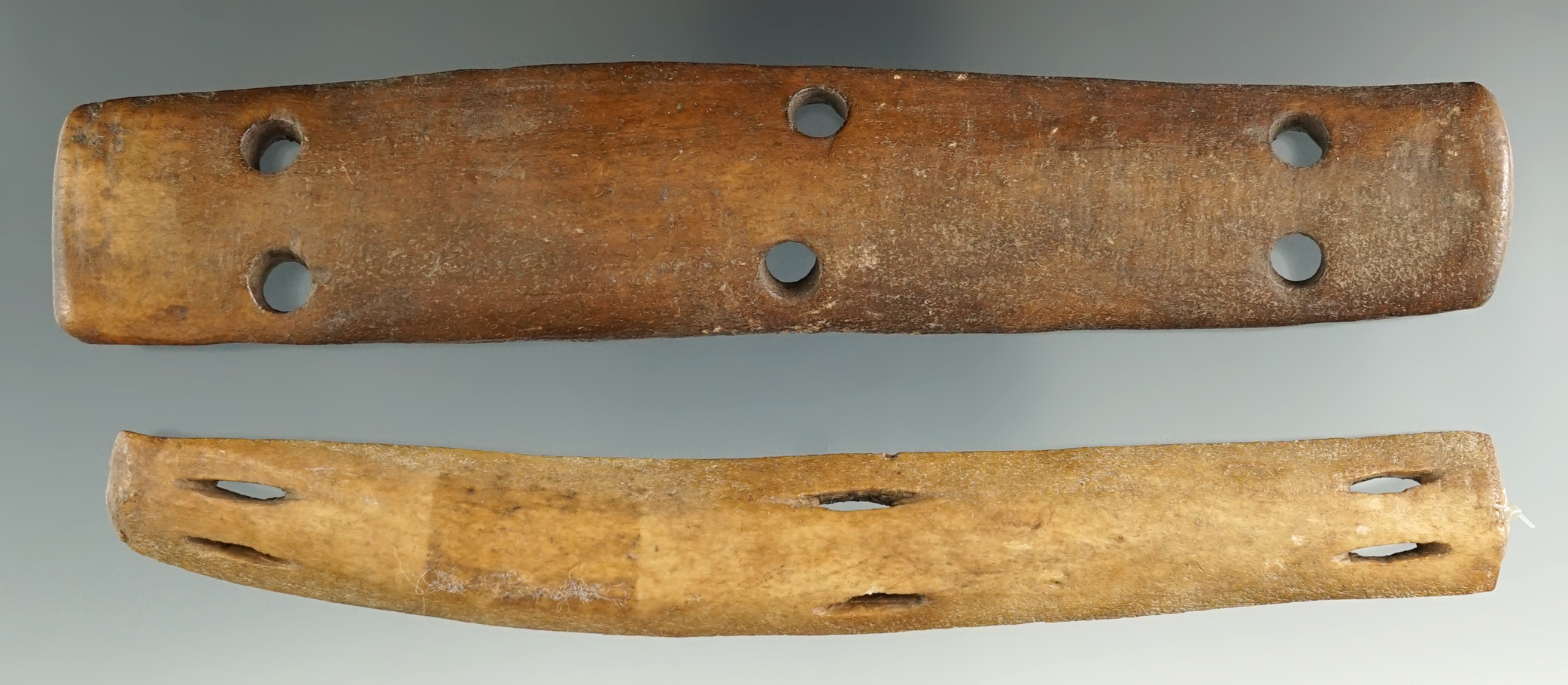 Two pieces of Bone Armor found in Alaska, largest is 1 1/8". Comes with a Bennett COA.