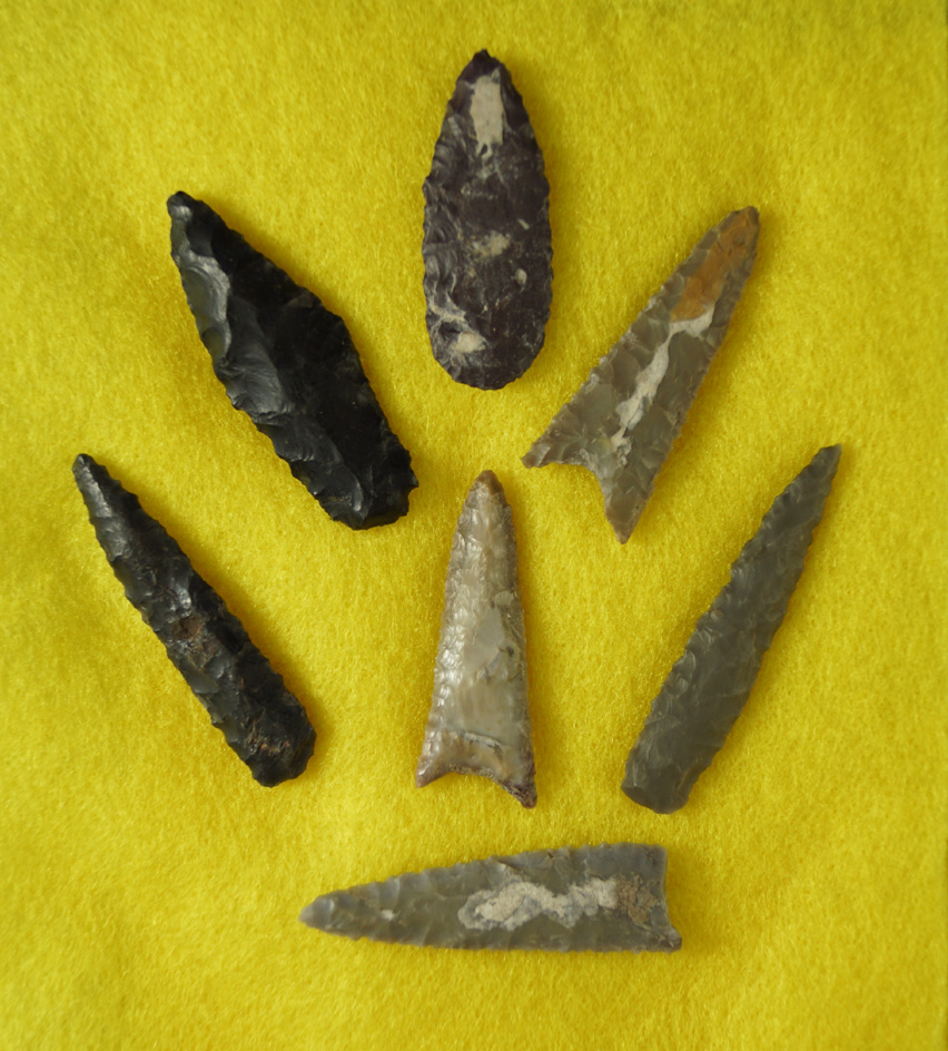 Set of seven Triangular-shaped projectile points including Canalino triangular -= Ventura Co., CA.