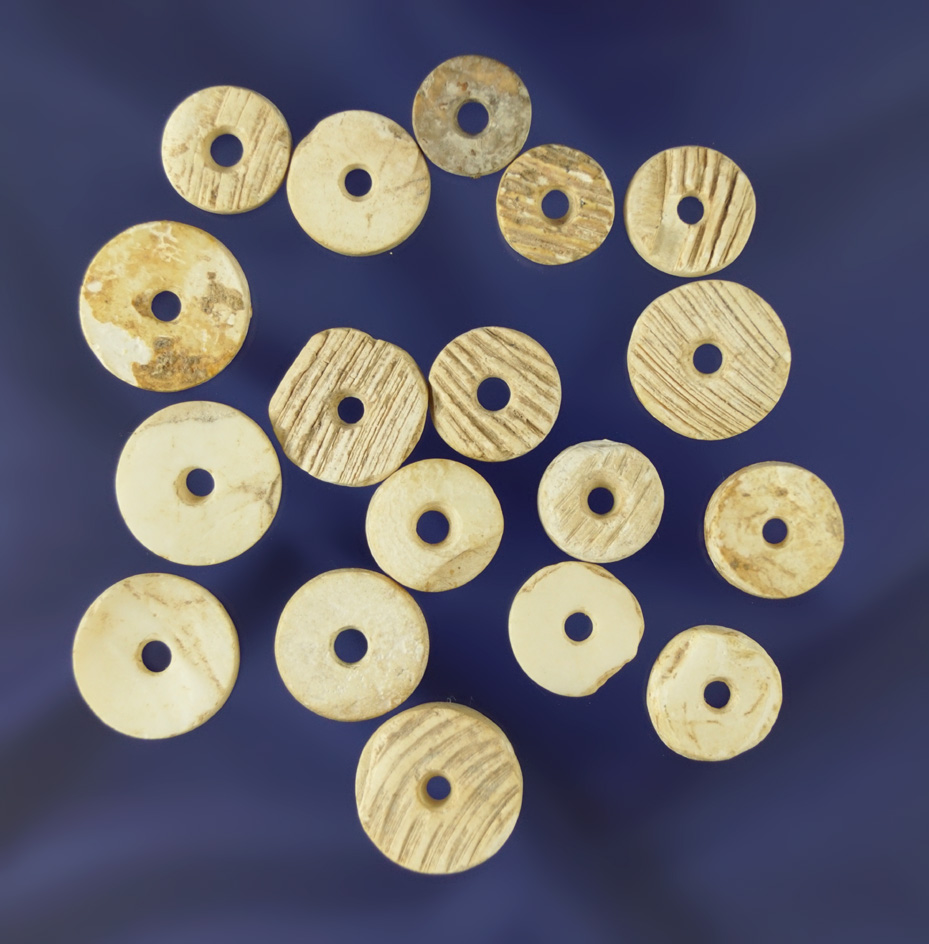 Nice group of 18 drilled Chumash shell beads Found in California. Largest is 5/8" diameter.