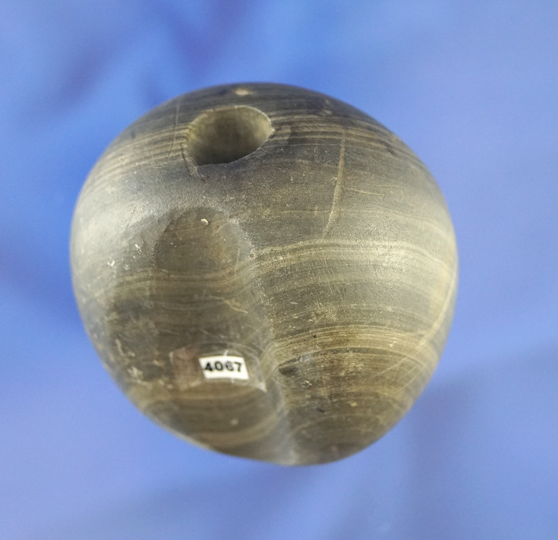 Niecly Fluted 2 3/16" Ball Bannerstone found in Indiana. Well patinated, nicely styled!  Elleman.