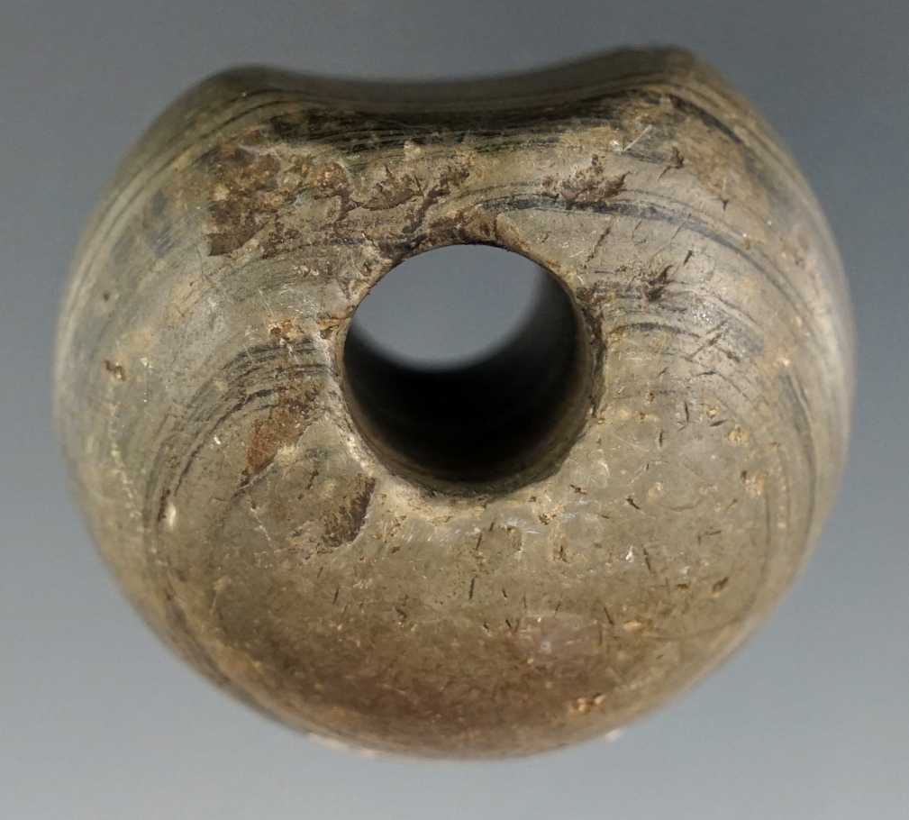 1 5/8" Fluted Ball Bannerstone made from nicely patinated Banded Slate.. Ex. William Waigle.