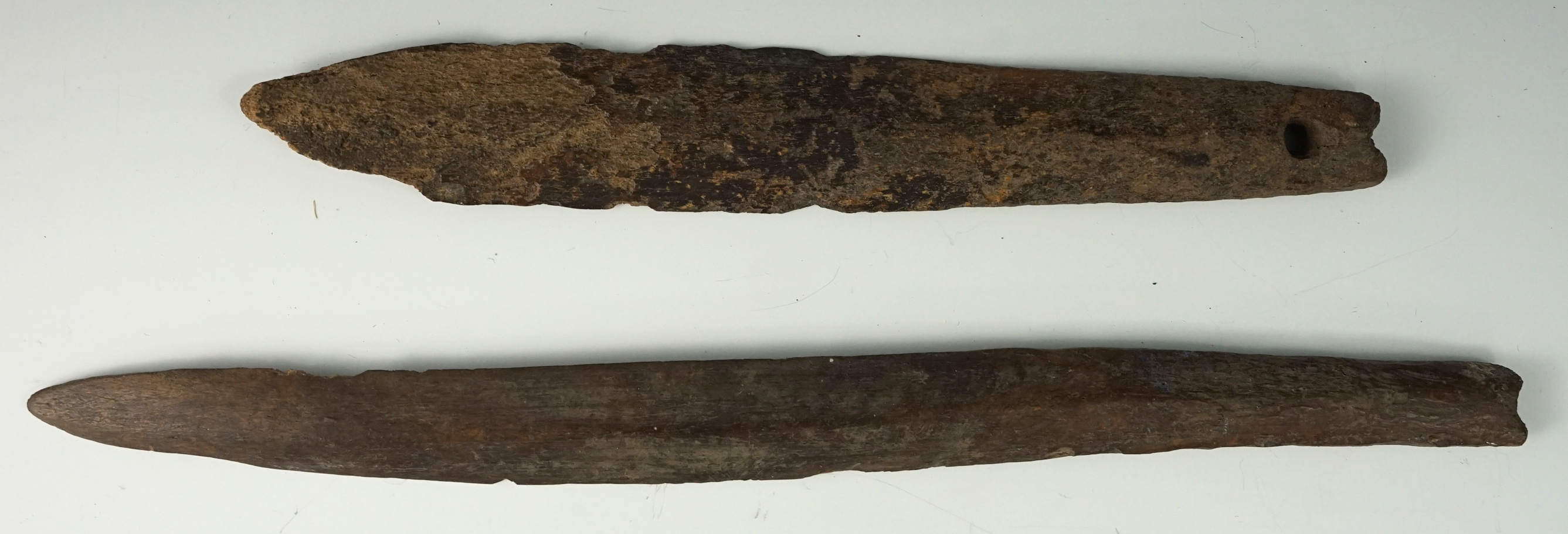 Pair of Inuit bone spears recovered in Alaska. Largest is 11 3/8".