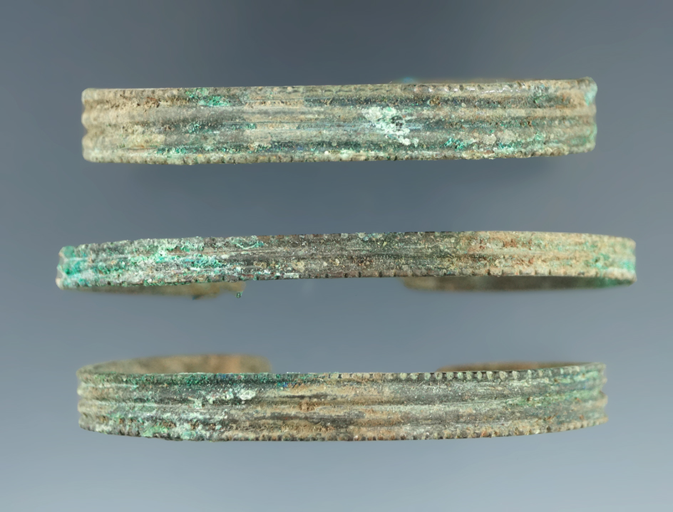 Set of three Copper Trade Bracelets found in New York, largest is 2 1/2" wide.