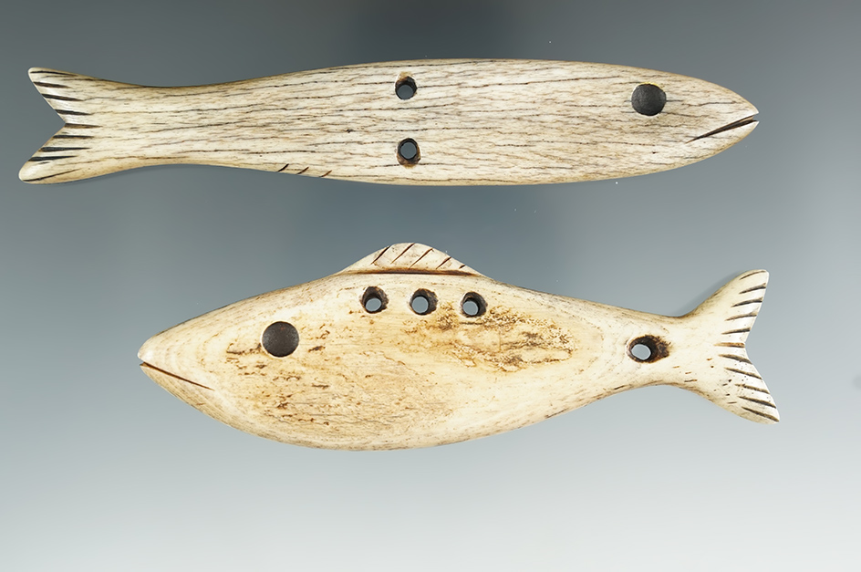 Pair of vintage bone Inuit fishing lures from Alaska, largest is 4 7/8".