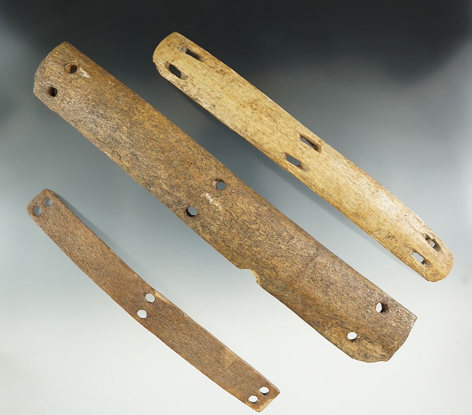 Three sections of very old Inuit bone armor. Largest measures 8 3/4". Found in Alaska.