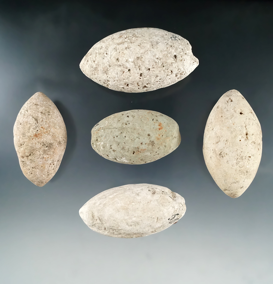 Set of five bolo stones collected by a GI during World War II on the island of Guam.