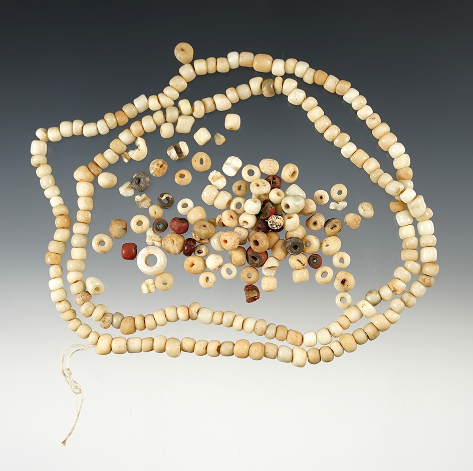 24" strand of beads with a nice selection of loose beads. 