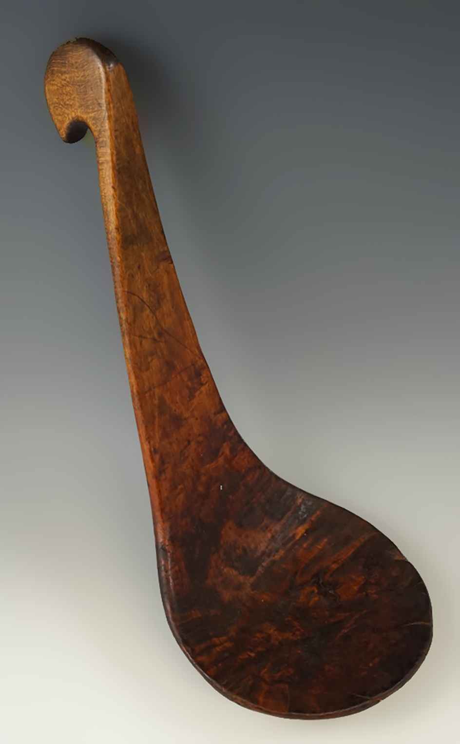 Beautifully carved 10 1/2" tall Burl Wood spoon from the Northeast area.