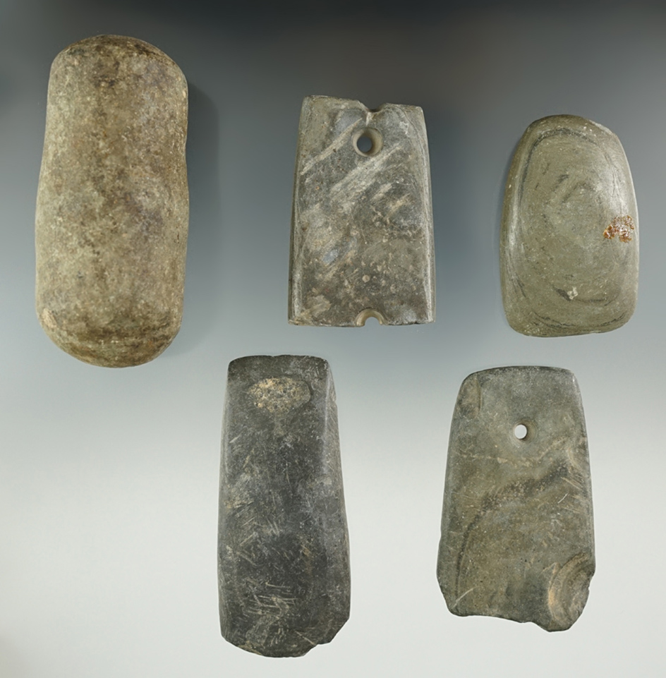 Set of five Ohio artifacts including 2 damaged slate ornaments, 2 slate celts, and a knapping tool.