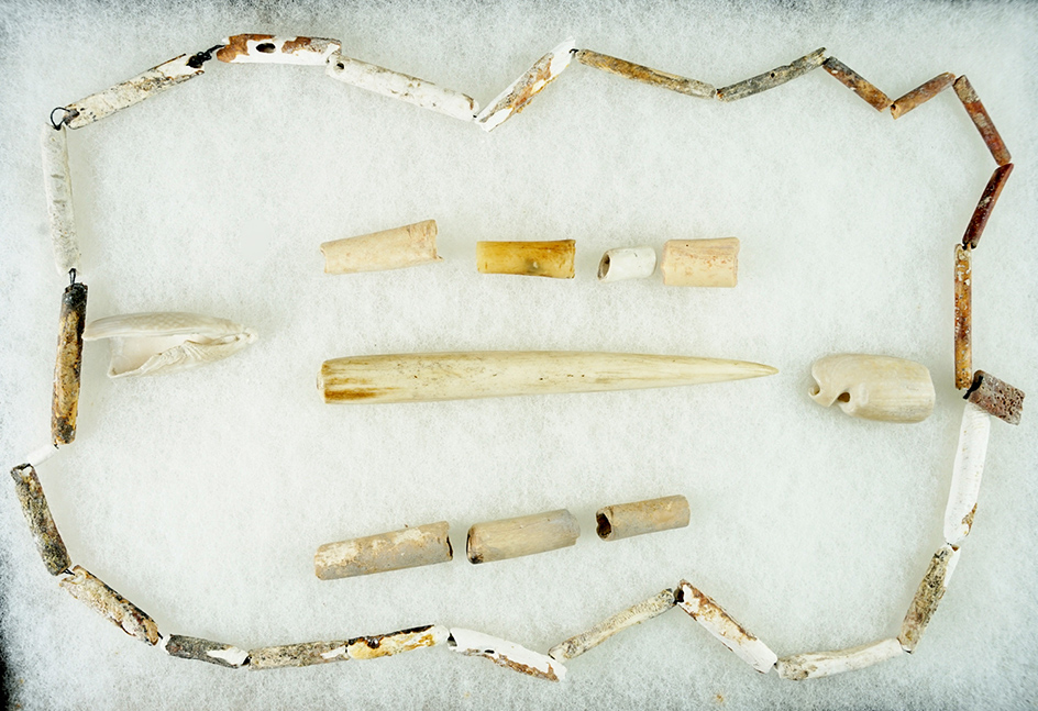 Nice frame of bone and shell beads.