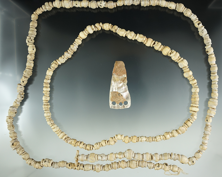 Two strands of very unique beads and a 2 1/4" three hole shell pendant found in California.