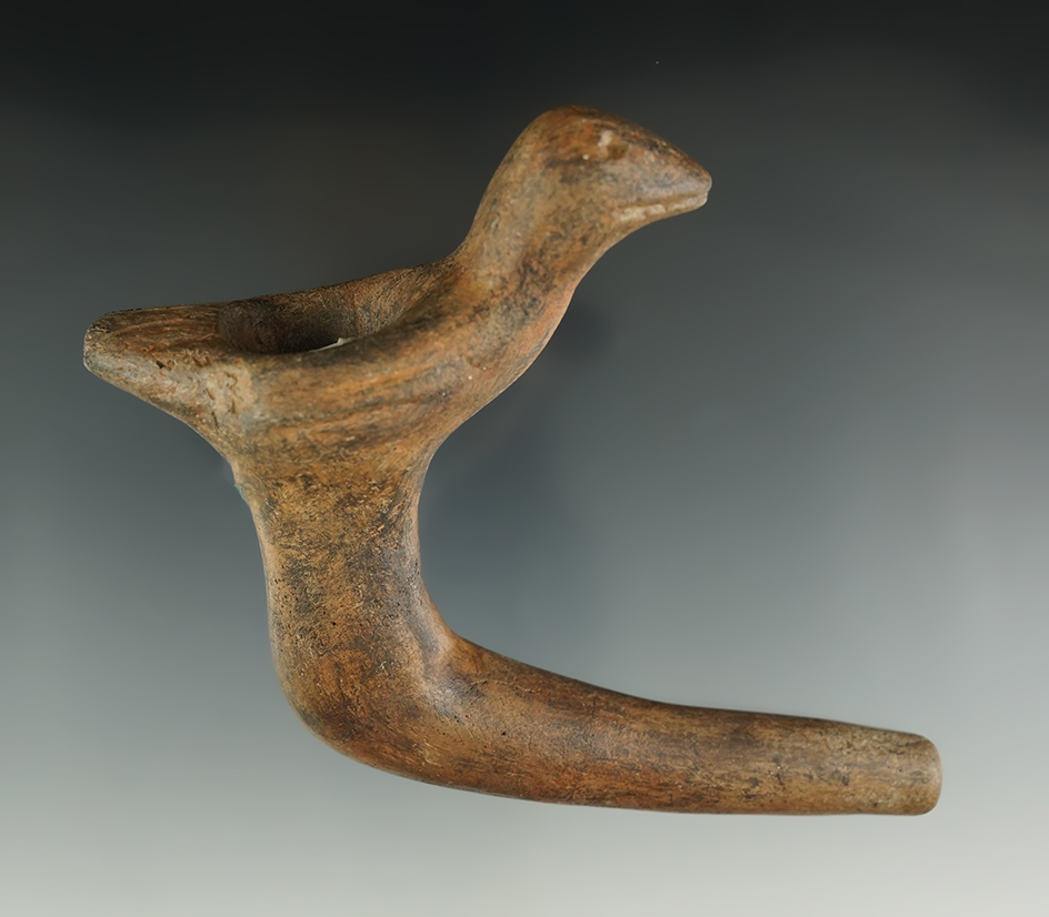 4 3/8" long Iroquois clay bird effigy pipe with restoration to the effigy and elbow areas. NY.