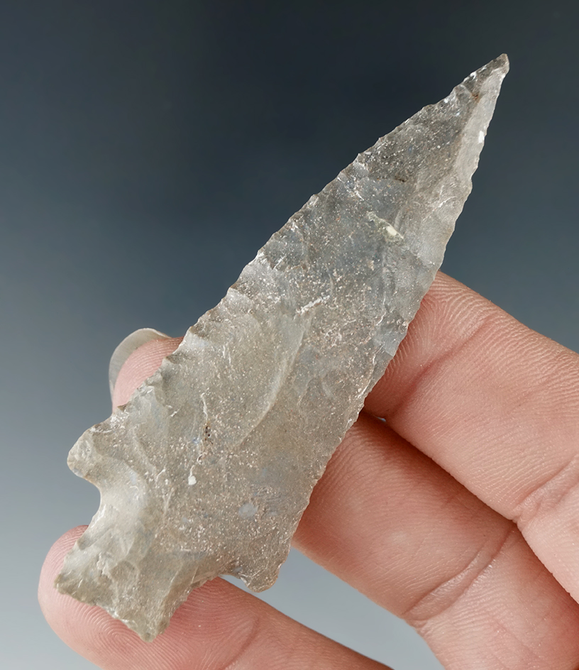 Well styled 2 3/4" stemmed dart point found in Tennessee.